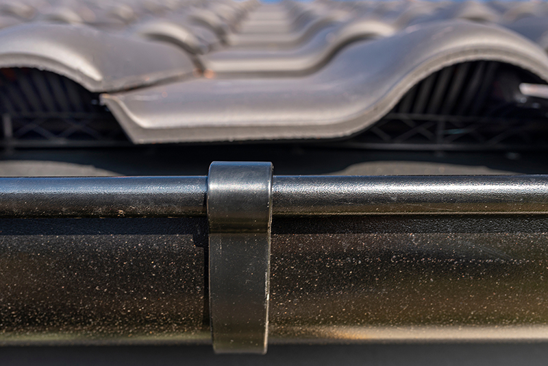 close-up-of-roof-tiles-and-gutter-system-2026-03-24-09-00-40-utc (1)