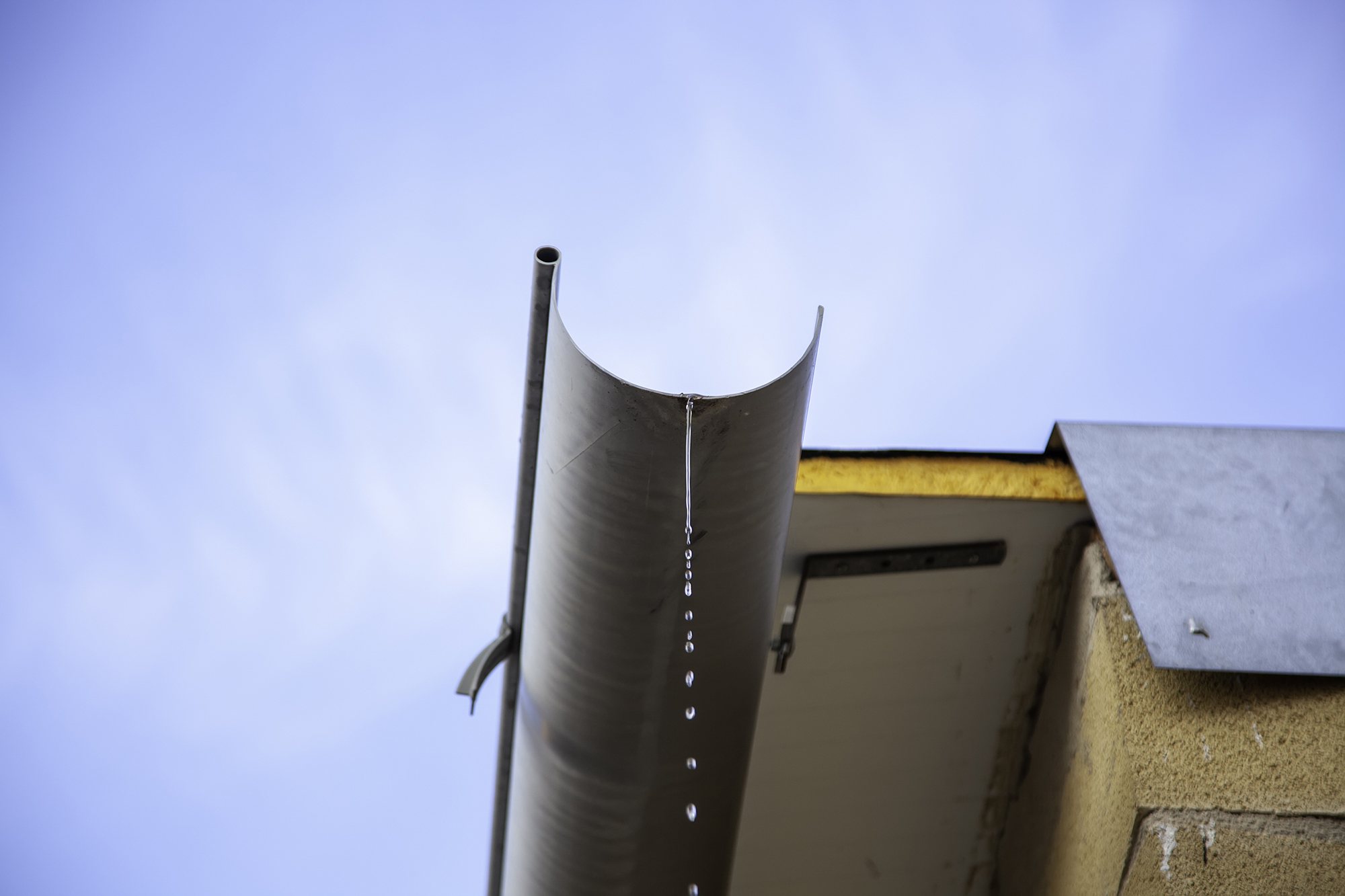 rain-gutter-with-clear-blue-sky-background-2026-03-25-22-49-02-utc